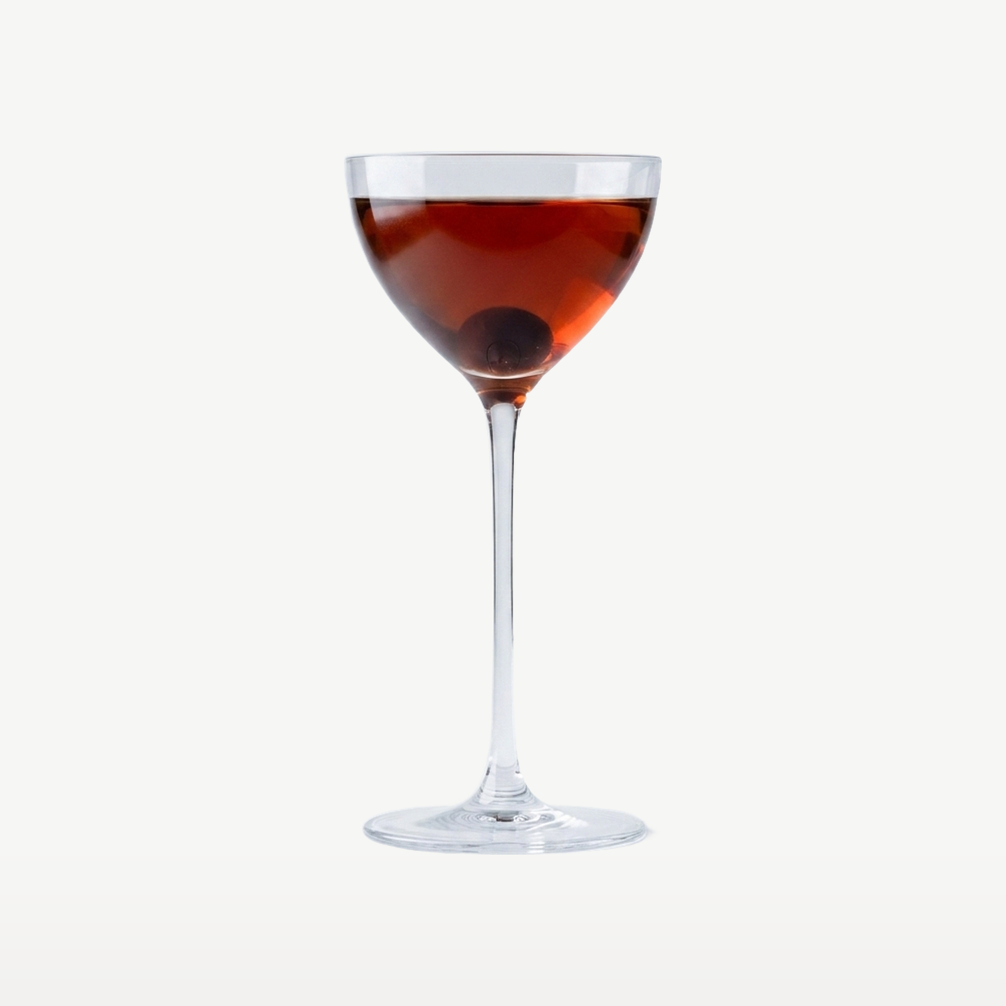 Onis Bespoke Cocktailglas 15,5 Cl Nick & Nora gevuld met cocktail - Glazen.nl